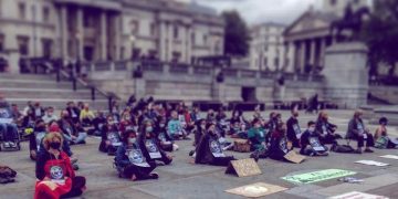 Extinction Rebellion protestors hold a silent vigil.