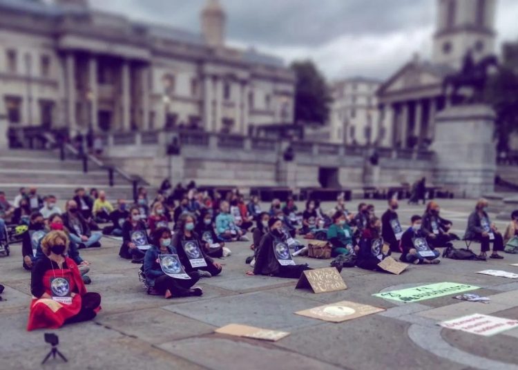 Extinction Rebellion protestors hold a silent vigil.