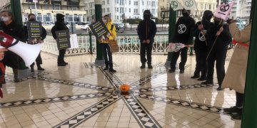 protesters on the bandstand in Brighton