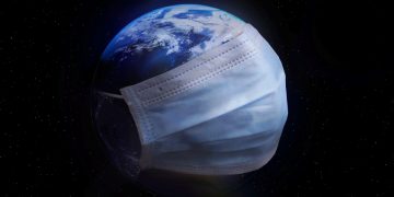 the earth wearing a covid mask