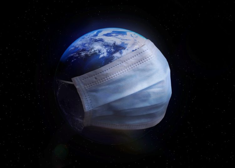 the earth wearing a covid mask