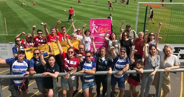 Spectators and players at Lewes FC