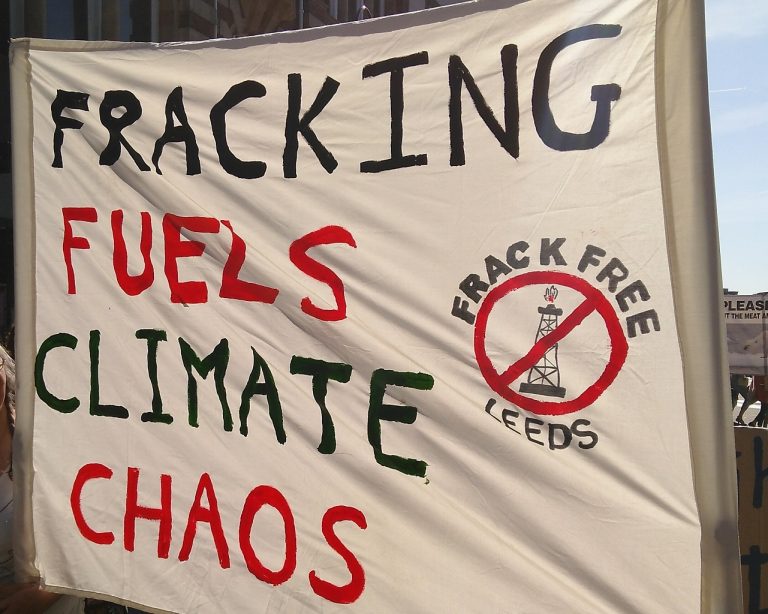 Poster that says 'Fracking Fuels Climate Chaos'