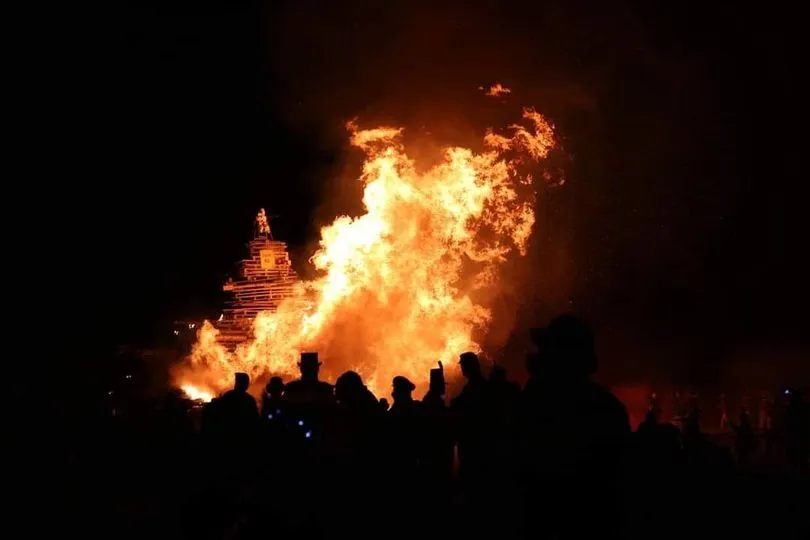 Photograph of a blazing bonfire at night