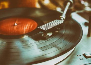 Closeup of textured retro record player in retro colors.