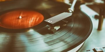 Closeup of textured retro record player in retro colors.