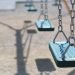 Empty swings in a playground