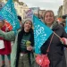 teachers with banners at a union solidarity rally in Hastings