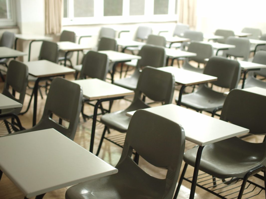 Empty chairs in an empty classroom
