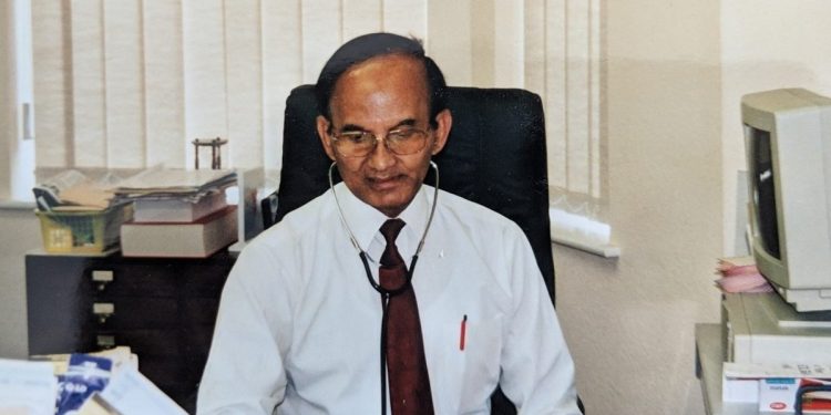 Dr Kanjilal in his GP surgery in Lowestoft, Suffolk in 1990s.
