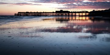Hastings Pier, reflected in the sand