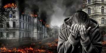 A composite image of buildings destroyed and on fire and a woman in despair