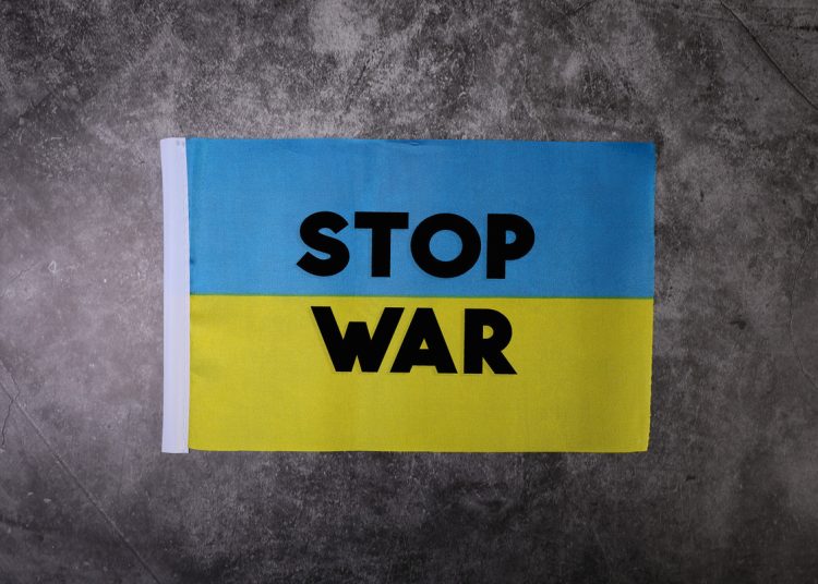 Ukraine flag with Stop war written on it