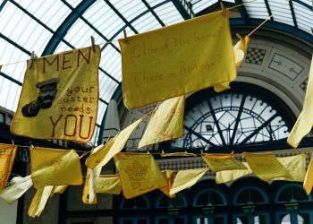A display of embroidered dusters from the Domestic Dusters project at Alexandra Palace