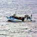 Boat at sea full of refugees