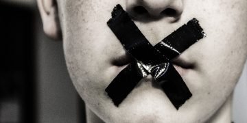 A taped up mouth