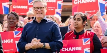 Keir Starmer surrounded by 'Change' placards