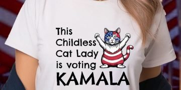 Woman wearing a T-shirt that says "This Childless Cat Lady is voting Kamala"