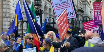 A photo of Rejoin marchers waving banners.