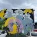 Colourful poster depicting street art in Dunedin.