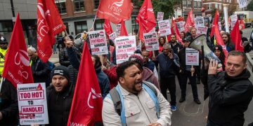 Bus drivers demonstrating with flags
