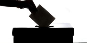 Vote being cast in ballot box