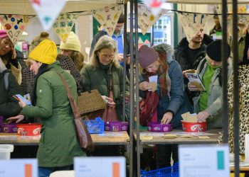People gathering at a seed-swapping event