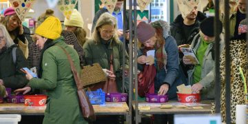 People gathering at a seed-swapping event