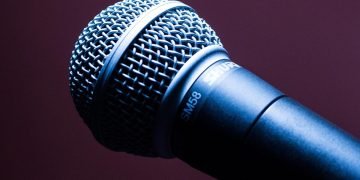 Photo of a microphone on a dark background