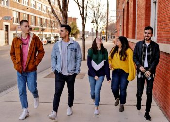 young people walking and talking and laughing