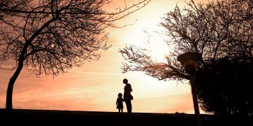 Silhouette of mother and child