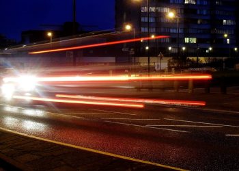 car lights on a town road
