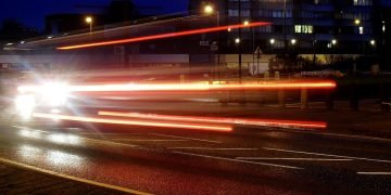 car lights on a town road