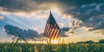 The American flag flying in a field