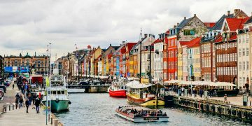 Tourists by the Nyhavn canal in Copenhagen
