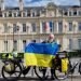 Vic Ient with the Ukrainian flag and bicycle
