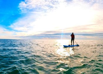 Jamie on his paddle board at sea.