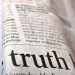 newspaper with the word truth in focus