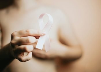 woman holding white ribbon