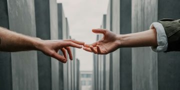 Two hands touching fingers to connect
