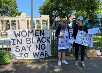 two women with placard No To War