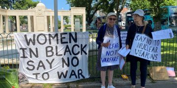 two women with placard No To War