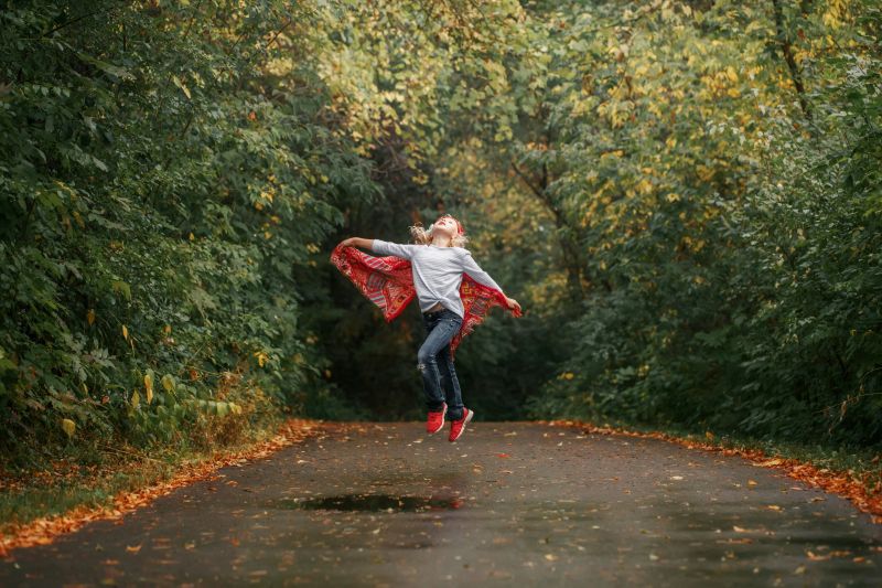 young girl dancing in the rain