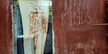 A drawing of a person and a sign saying Human Kinds