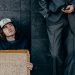 homeless man next to a businessman