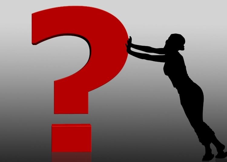 question mark pushed by silhouette of a woman