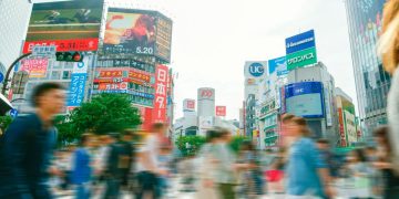 People rushing through a busy city