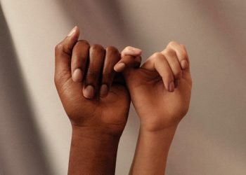 hands with little fingers linked