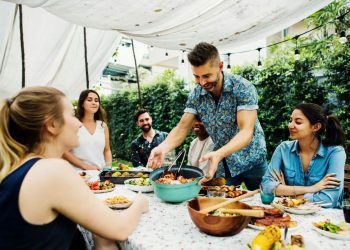 A group of friends sharing lunch outdoors