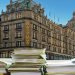 Harrods with piles of paper superimposed on it